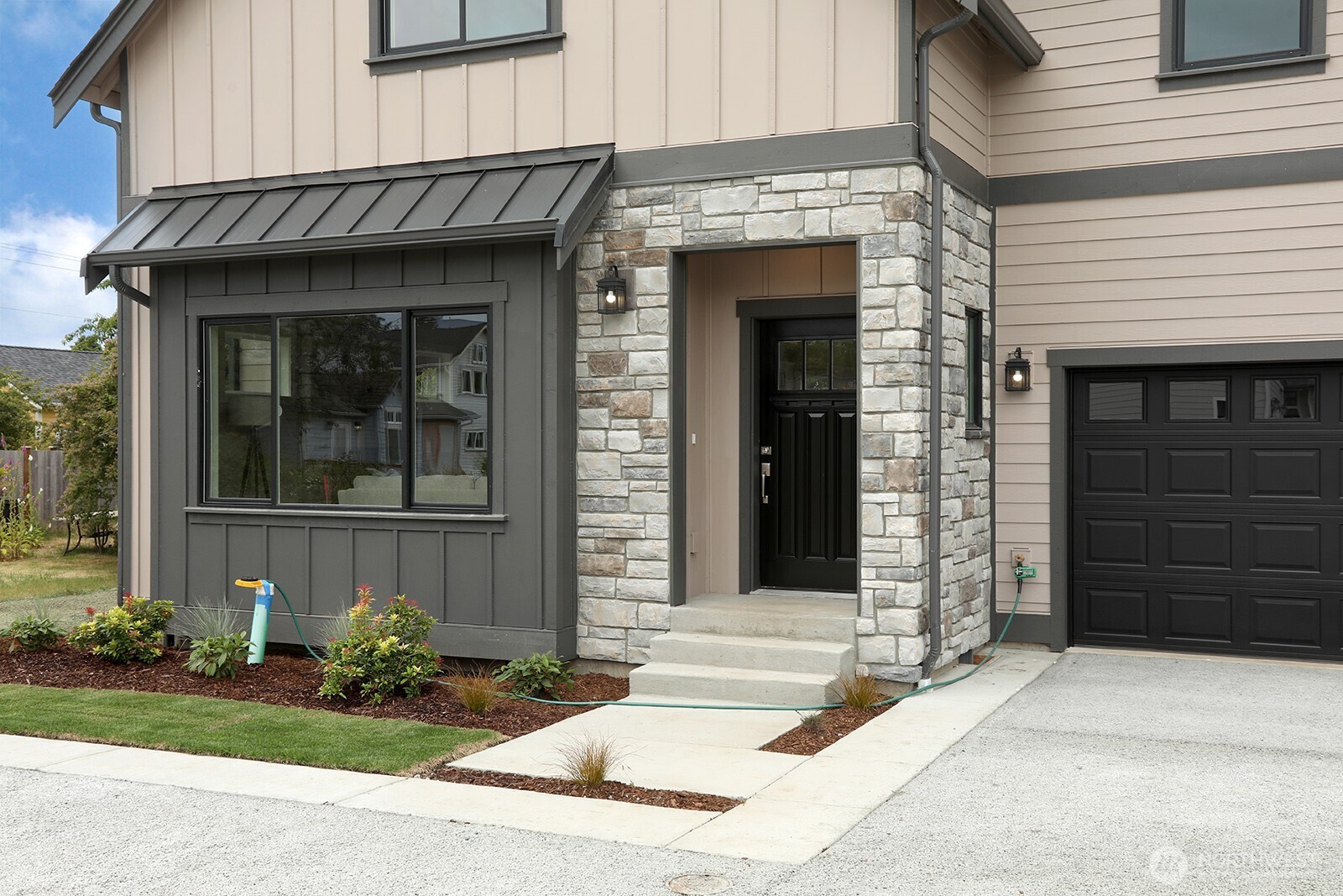 695 3rd Street, Unit A Langley, WA 98260 - Photo 2 of 28 a front view of a house with a yard
