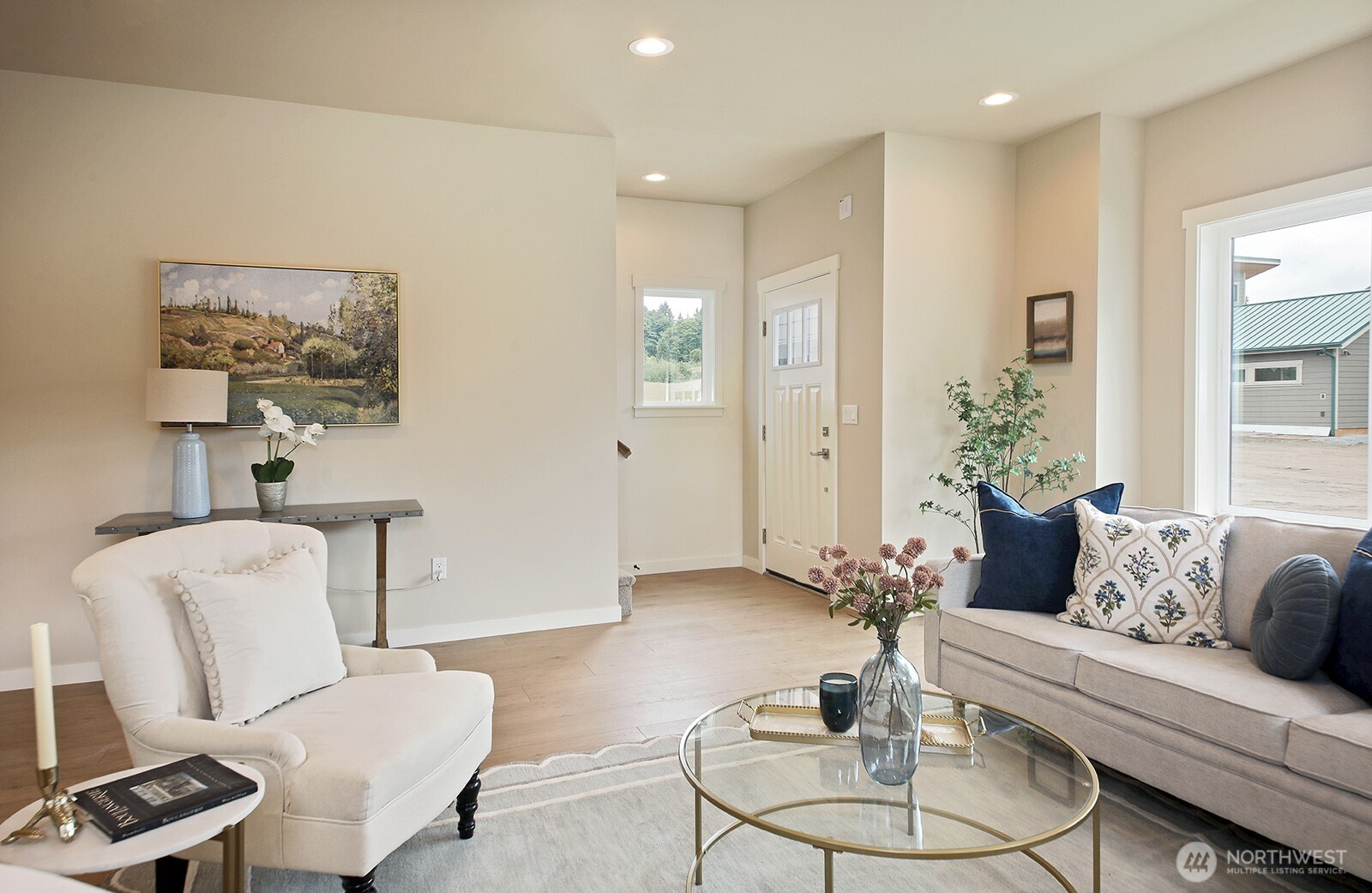 695 3rd Street, Unit A Langley, WA 98260 - Photo 5 of 28 a living room with furniture and a potted plant