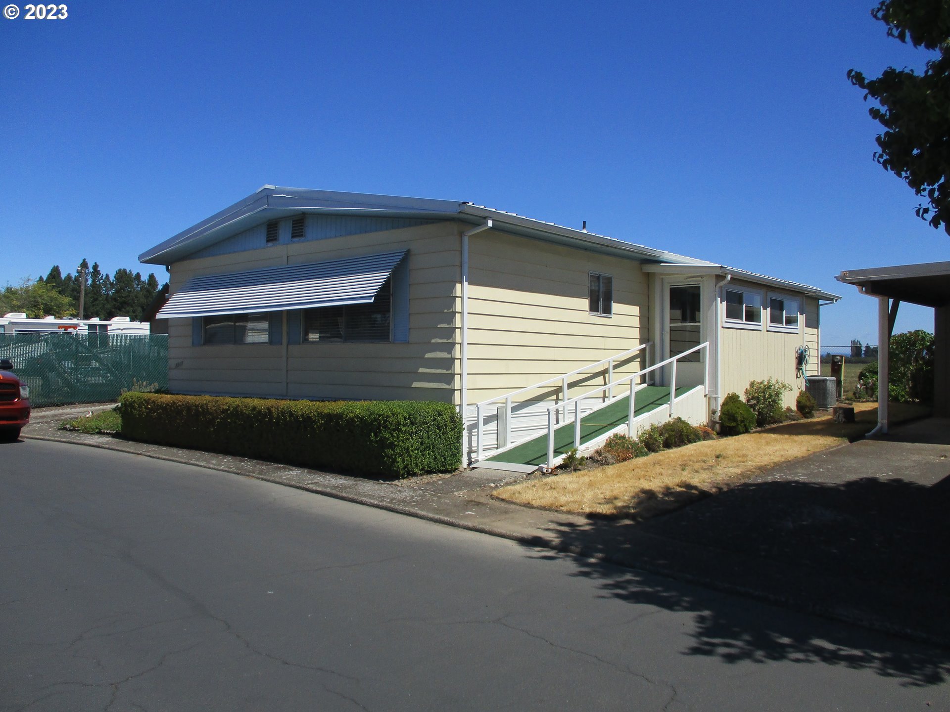 3387 Rainbow Loop Hubbard, OR 97032 - Photo 1 of 19 a front view of a house with a yard