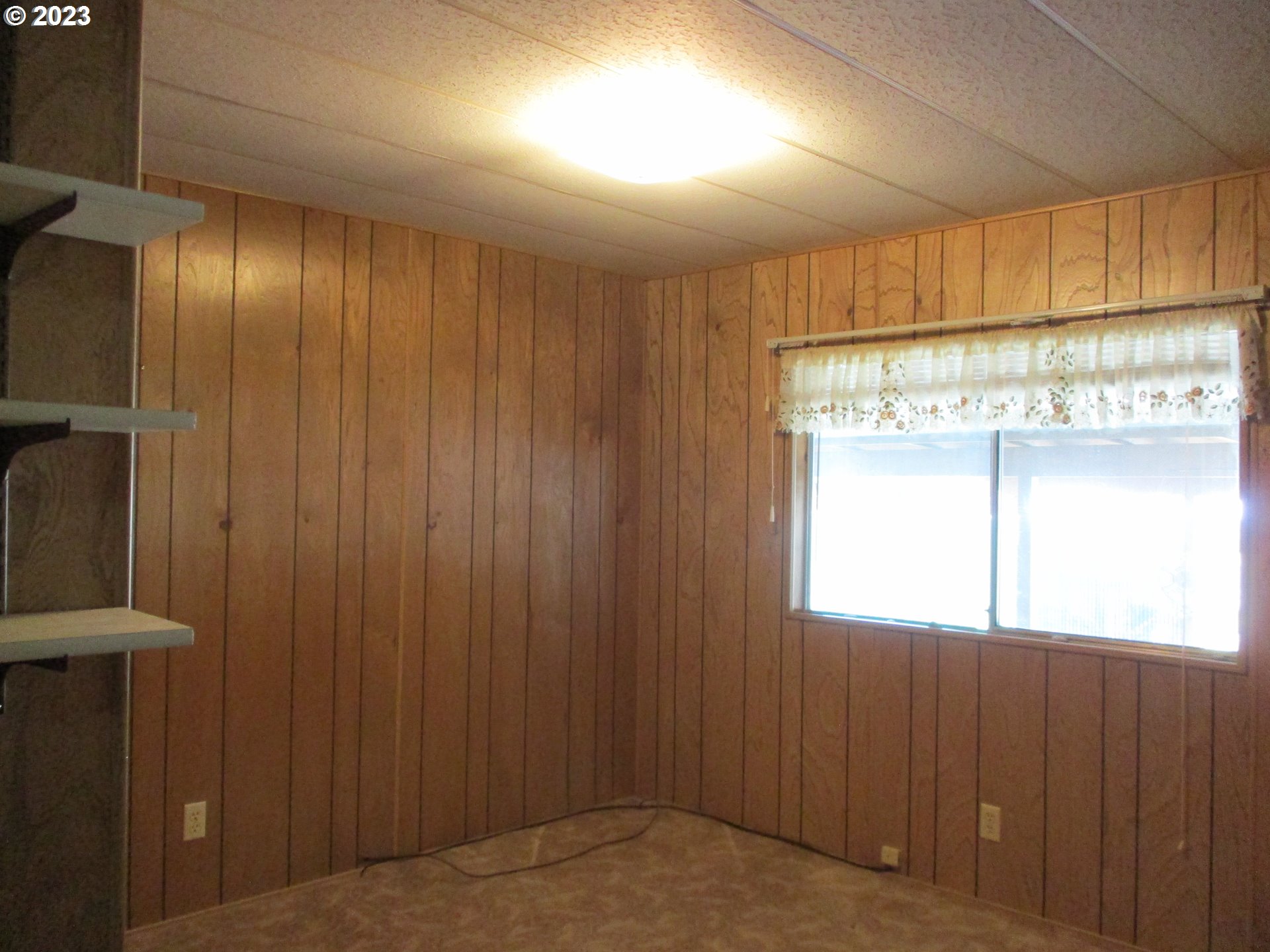 3387 Rainbow Loop Hubbard, OR 97032 - Photo 11 of 19 a view of an empty room with a window