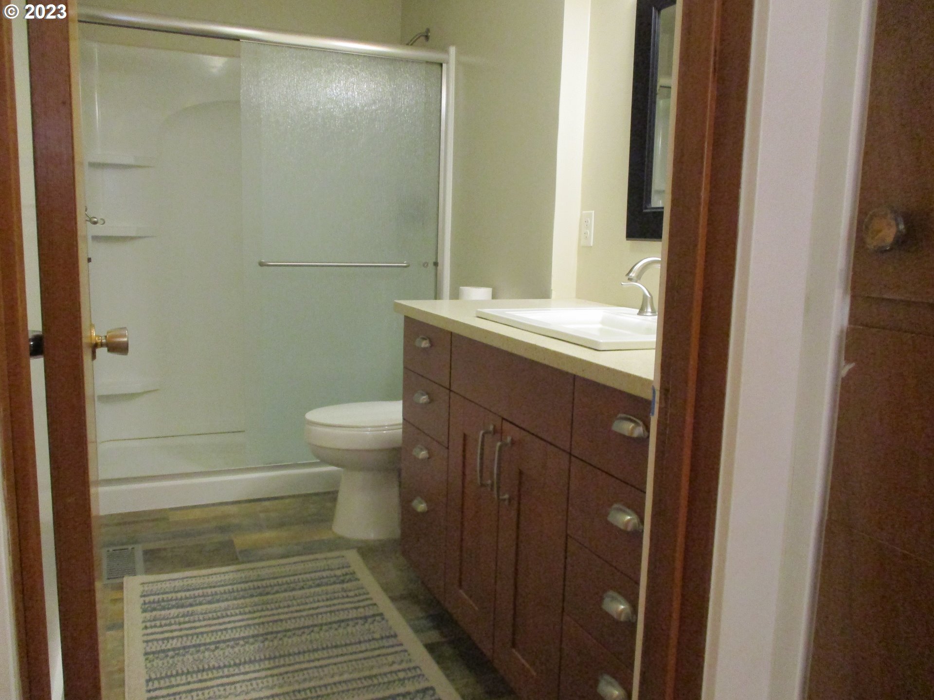 3387 Rainbow Loop Hubbard, OR 97032 - Photo 13 of 19 a bathroom with a sink a toilet and shower