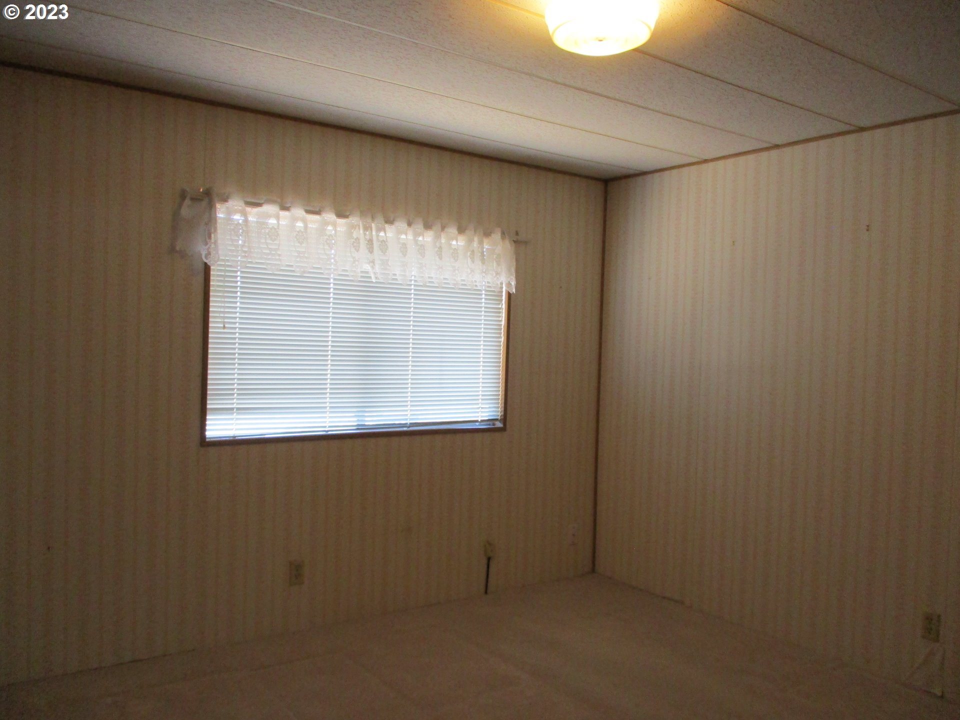 3387 Rainbow Loop Hubbard, OR 97032 - Photo 15 of 19 a view of an empty room with a window
