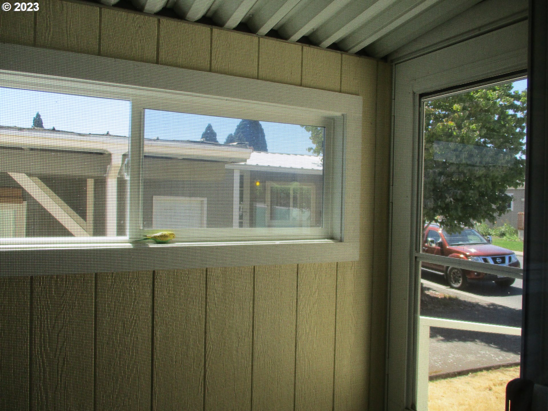 3387 Rainbow Loop Hubbard, OR 97032 - Photo 17 of 19 a view of a window and a tree