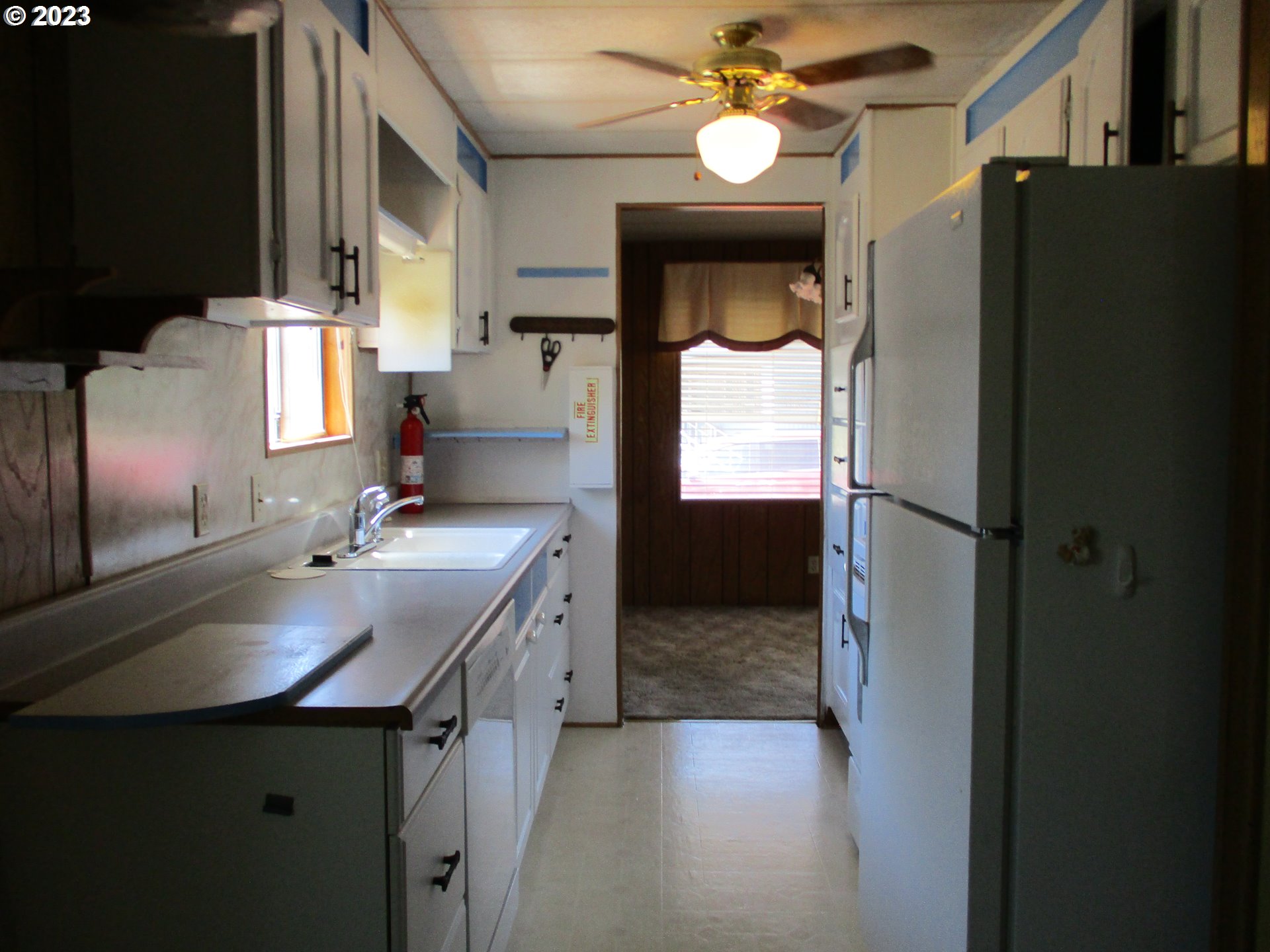 3387 Rainbow Loop Hubbard, OR 97032 - Photo 7 of 19 a kitchen with a sink appliances and cabinets