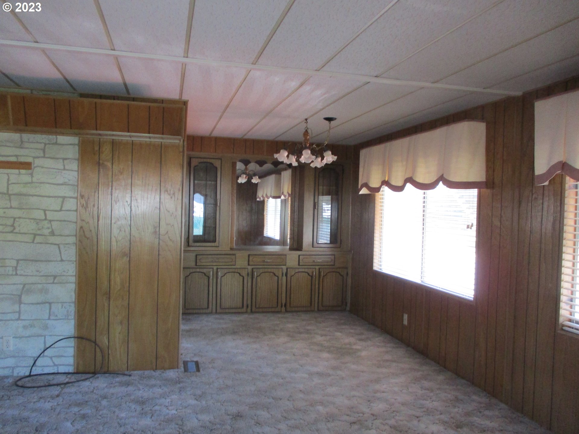 3387 Rainbow Loop Hubbard, OR 97032 - Photo 8 of 19 a room with chandelier and window