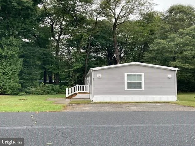 a house with a tree in front of it