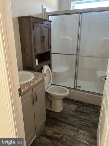 a bathroom with a sink and toilet