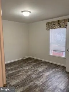 a view of an empty room and window