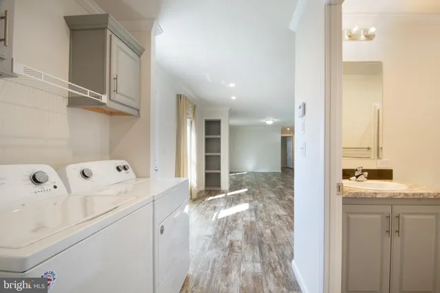 a view of a bathroom with a sink and mirror