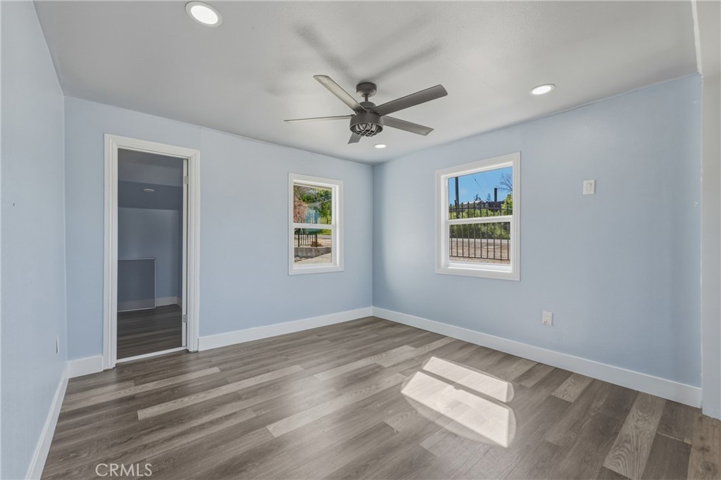 4629 Hill Road Lakeport, CA 95453 - Photo 12 of 69 an empty room with windows and fan