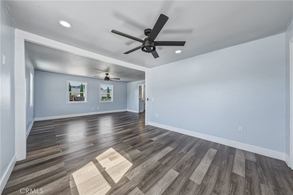 4629 Hill Road Lakeport, CA 95453 - Photo 13 of 69 a view of a livingroom with wooden floor and a ceiling fan