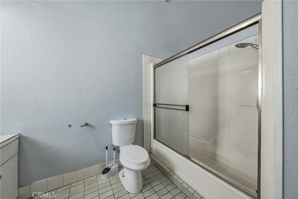 4629 Hill Road Lakeport, CA 95453 - Photo 23 of 69 a bathroom with a toilet and a shower