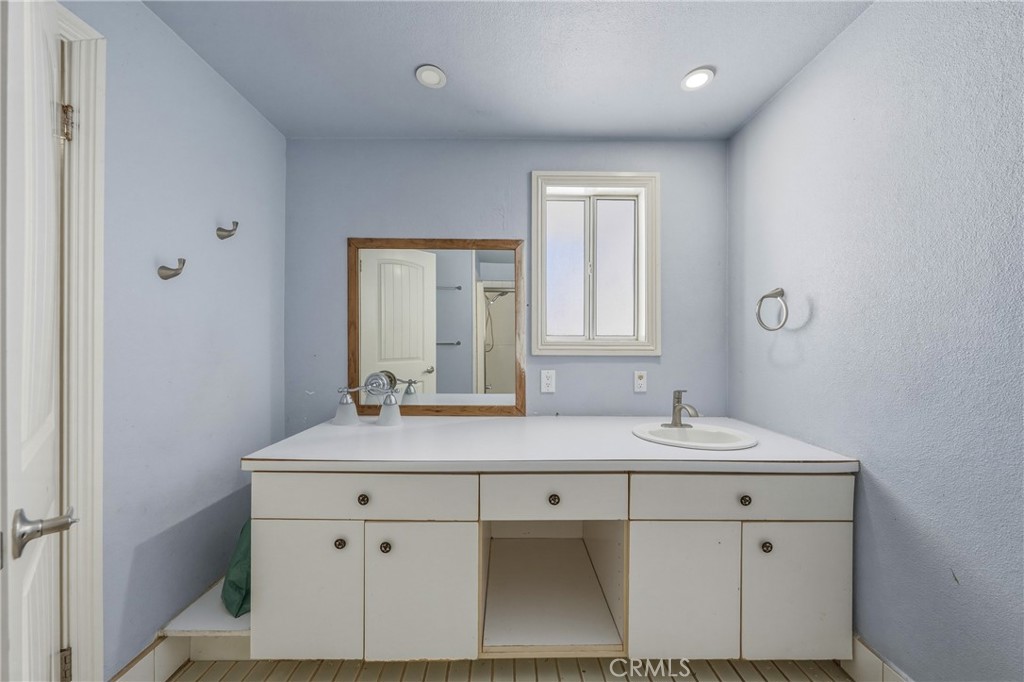 4629 Hill Road Lakeport, CA 95453 - Photo 24 of 69 a bathroom with a sink and a mirror