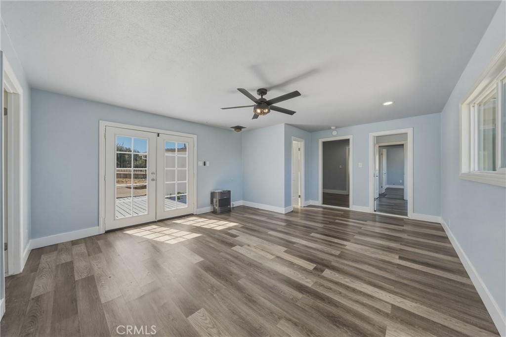 4629 Hill Road Lakeport, CA 95453 - Photo 26 of 69 a view of an empty room with a window and wooden floor