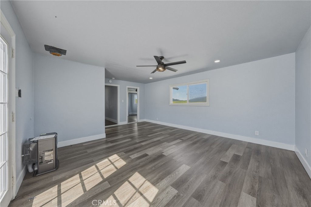 4629 Hill Road Lakeport, CA 95453 - Photo 27 of 69 a view of an empty room with wooden floor and a window