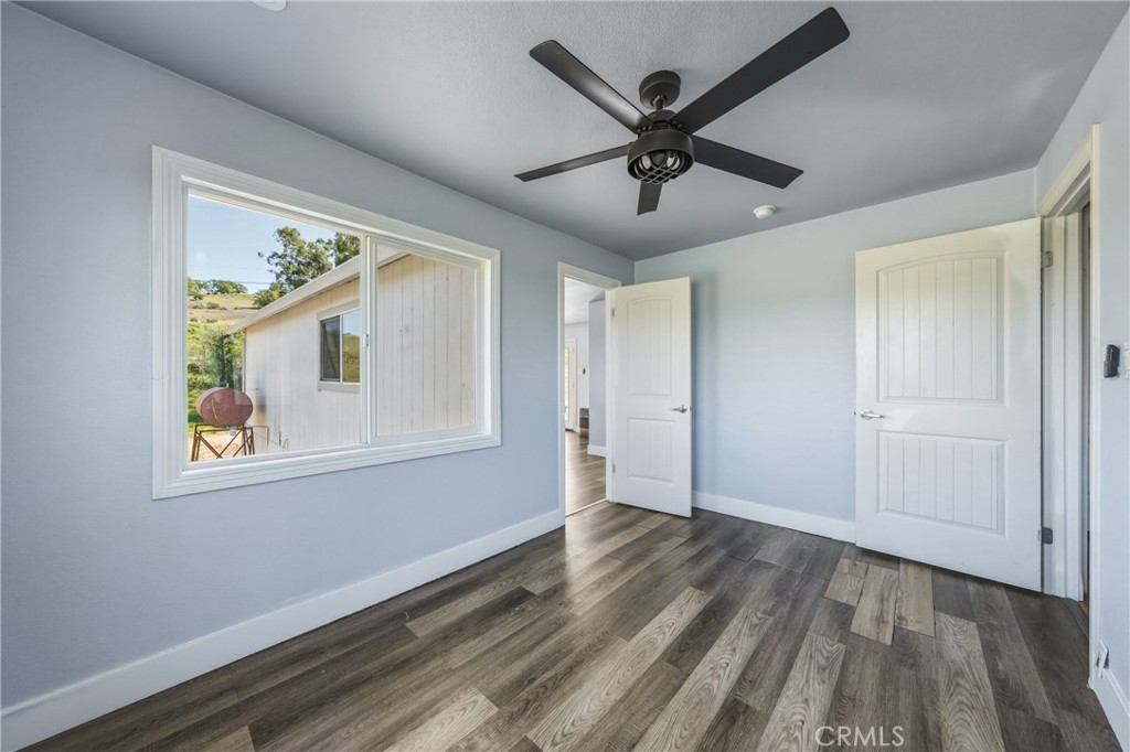 4629 Hill Road Lakeport, CA 95453 - Photo 29 of 69 a view of an empty room with wooden floor and a window