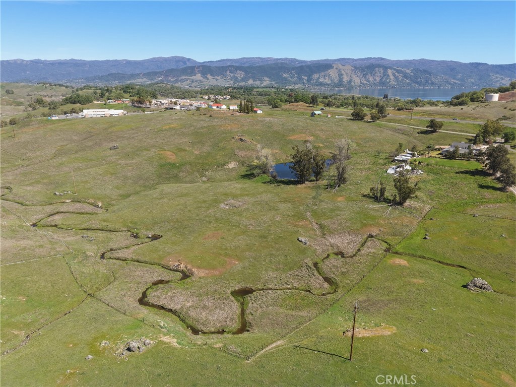 4629 Hill Road Lakeport, CA 95453 - Photo 50 of 69 a view of a lake with mountains in the background