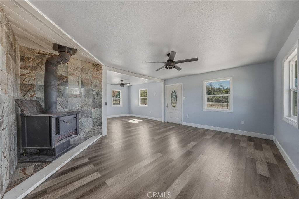 4629 Hill Road Lakeport, CA 95453 - Photo 10 of 69 a view of an empty room with a window and wooden floor