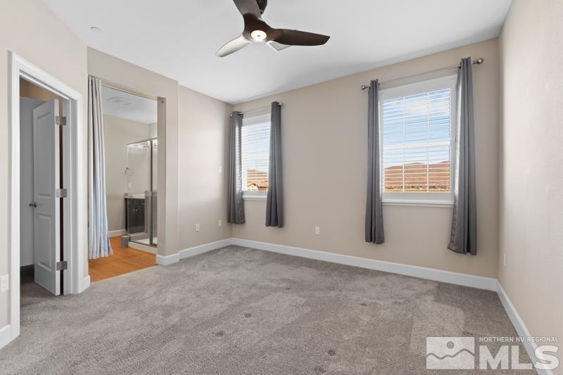 1900 Dark Horse Road, Unit B Reno, NV 89521 - Photo 11 of 34 a view of an empty room with a window