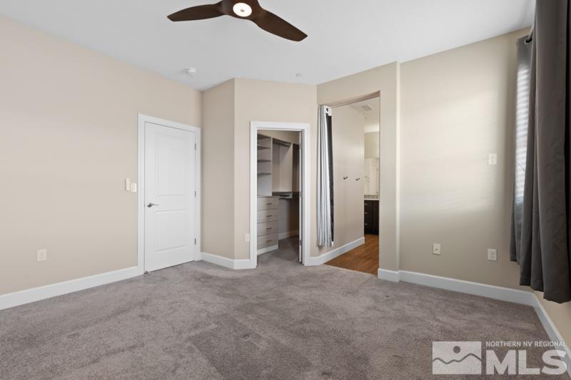 1900 Dark Horse Road, Unit B Reno, NV 89521 - Photo 12 of 34 an empty room with a ceiling fan and entryway