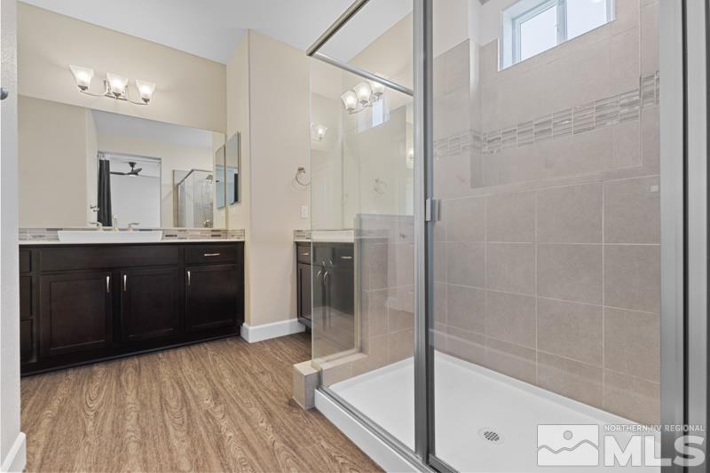 1900 Dark Horse Road, Unit B Reno, NV 89521 - Photo 14 of 34 a bathroom with a granite countertop sink mirror and shower
