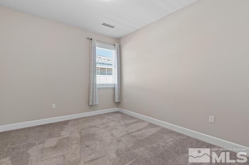 1900 Dark Horse Road, Unit B Reno, NV 89521 - Photo 15 of 34 a view of an empty room and window