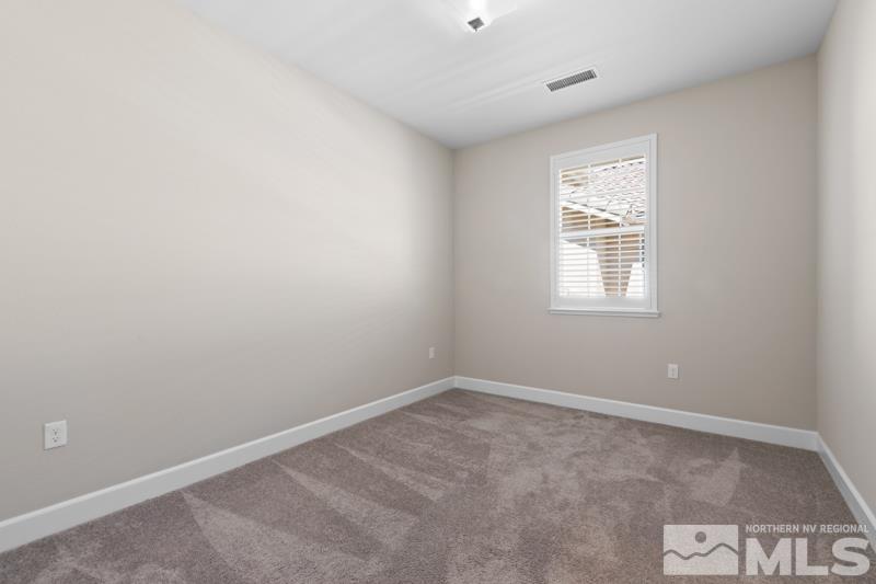 1900 Dark Horse Road, Unit B Reno, NV 89521 - Photo 17 of 34 an empty room with windows