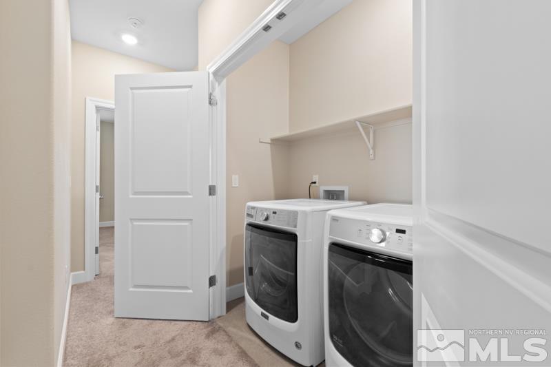 1900 Dark Horse Road, Unit B Reno, NV 89521 - Photo 20 of 34 a utility room with cabinets dryer and washer