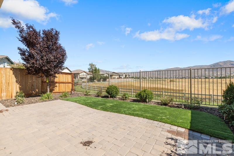 1900 Dark Horse Road, Unit B Reno, NV 89521 - Photo 22 of 34 a view of a house with a big yard and large trees