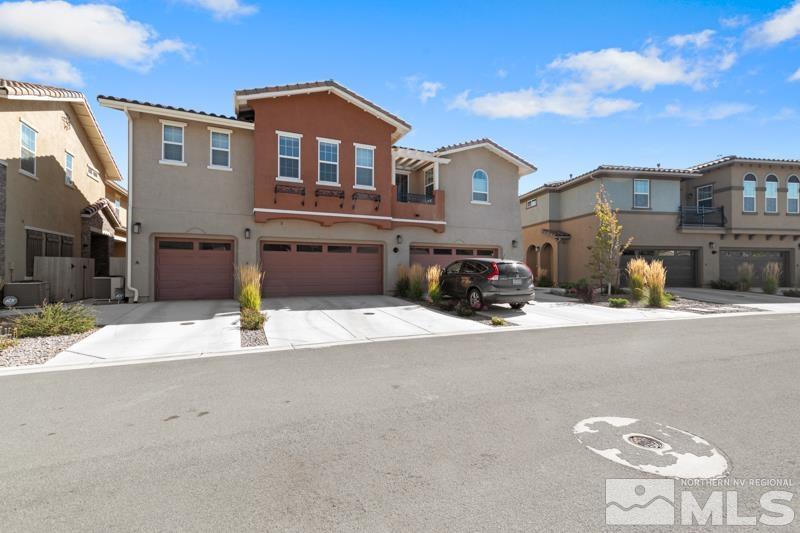 1900 Dark Horse Road, Unit B Reno, NV 89521 - Photo 24 of 34 a front view of a house with a yard