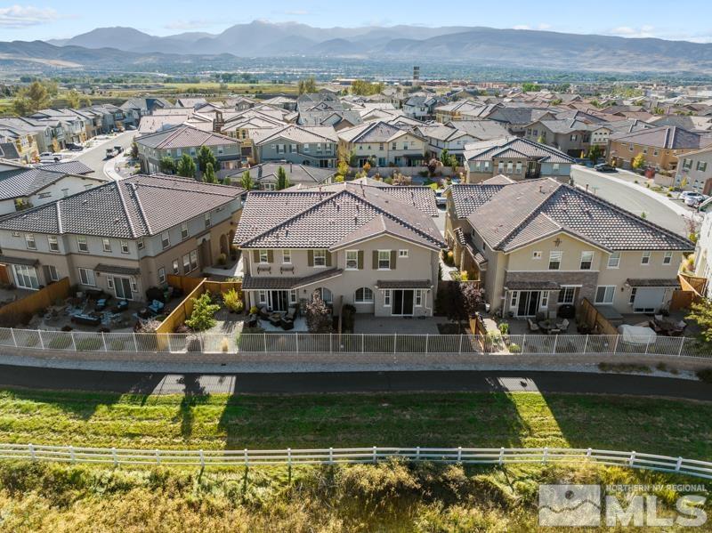 1900 Dark Horse Road, Unit B Reno, NV 89521 - Photo 27 of 34 an aerial view of residential houses with outdoor space and swimming pool