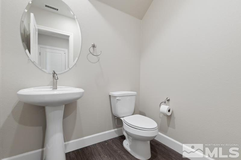 1900 Dark Horse Road, Unit B Reno, NV 89521 - Photo 10 of 34 a bathroom with a toilet sink and mirror