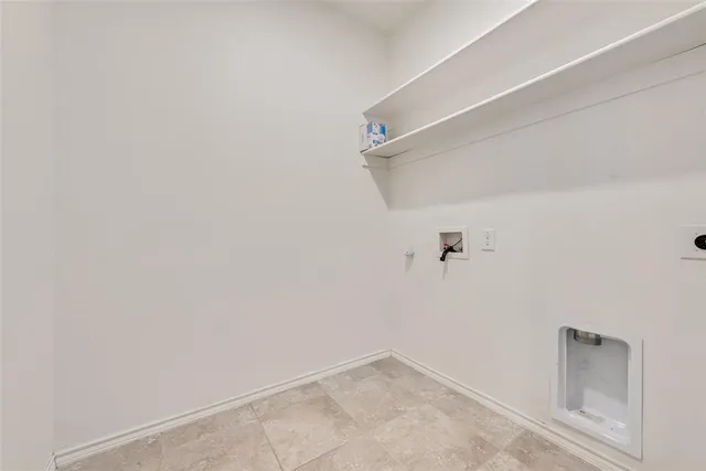 a view of an empty room with windows