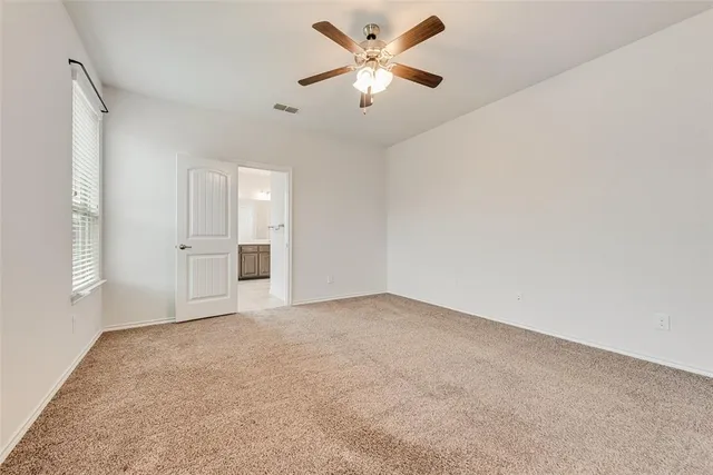 a bathroom with a large tub sink and mirror