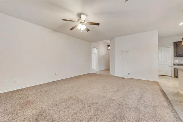 a view of a kitchen with microwave and stove top oven