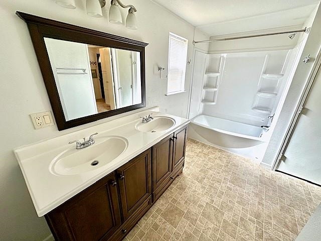 875 20 Road Fruita, CO 81521 - Photo 20 of 40 a bathroom with a double vanity sink a mirror and a bathtub