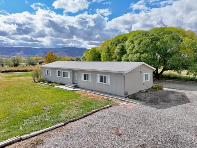 875 20 Road Fruita, CO 81521 - Photo 2 of 40 a front view of a house with a yard