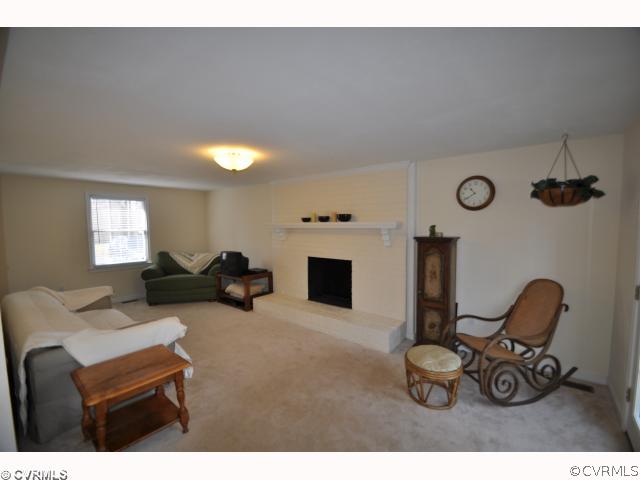 13808 Sutters Mill Road Midlothian, VA 23112 - Photo 3 of 12 a living room with furniture and a flat screen tv