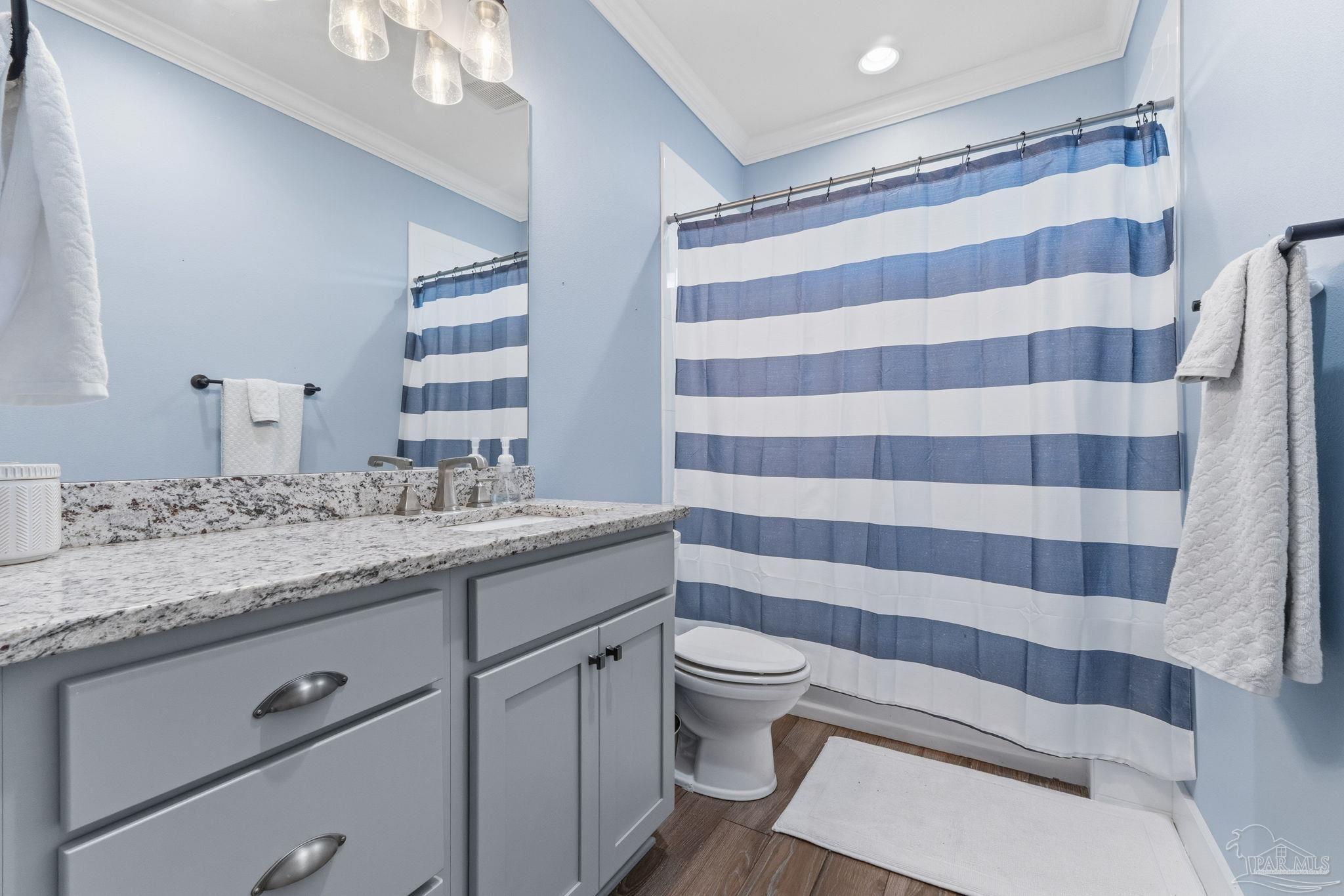 2018 Rambling Oaks Drive Cantonment, FL 32533 - Photo 13 of 64 a bathroom with a sink toilet and shower