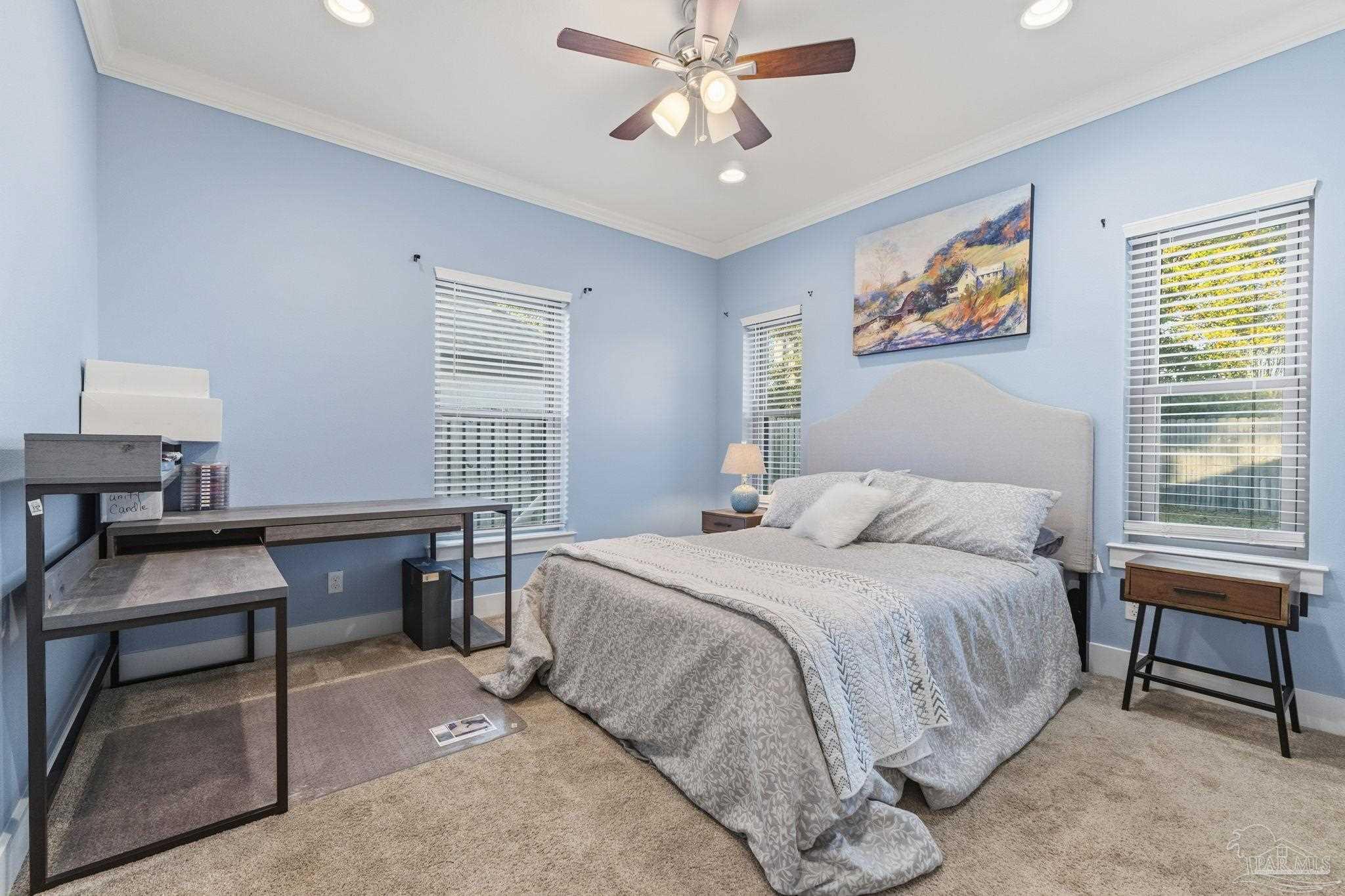 2018 Rambling Oaks Drive Cantonment, FL 32533 - Photo 14 of 64 a bedroom with a bed and a desk