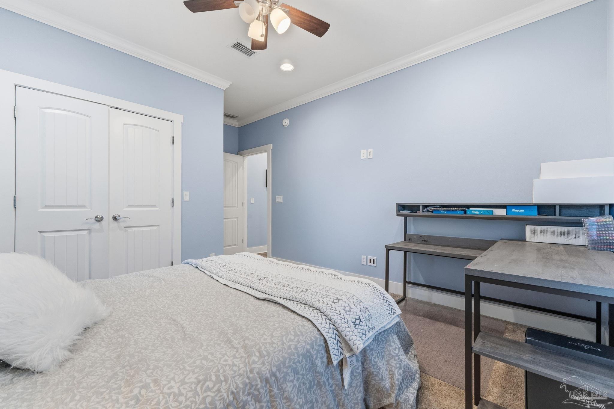 2018 Rambling Oaks Drive Cantonment, FL 32533 - Photo 15 of 64 a bedroom with a bed and a chandelier