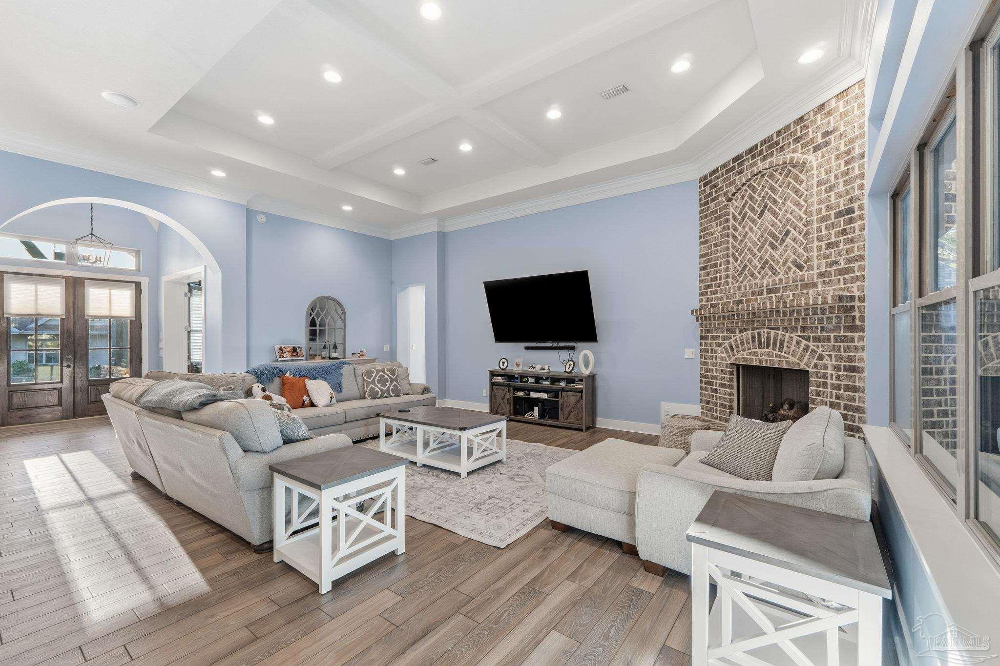 2018 Rambling Oaks Drive Cantonment, FL 32533 - Photo 18 of 64 a living room with furniture fireplace and flat screen tv