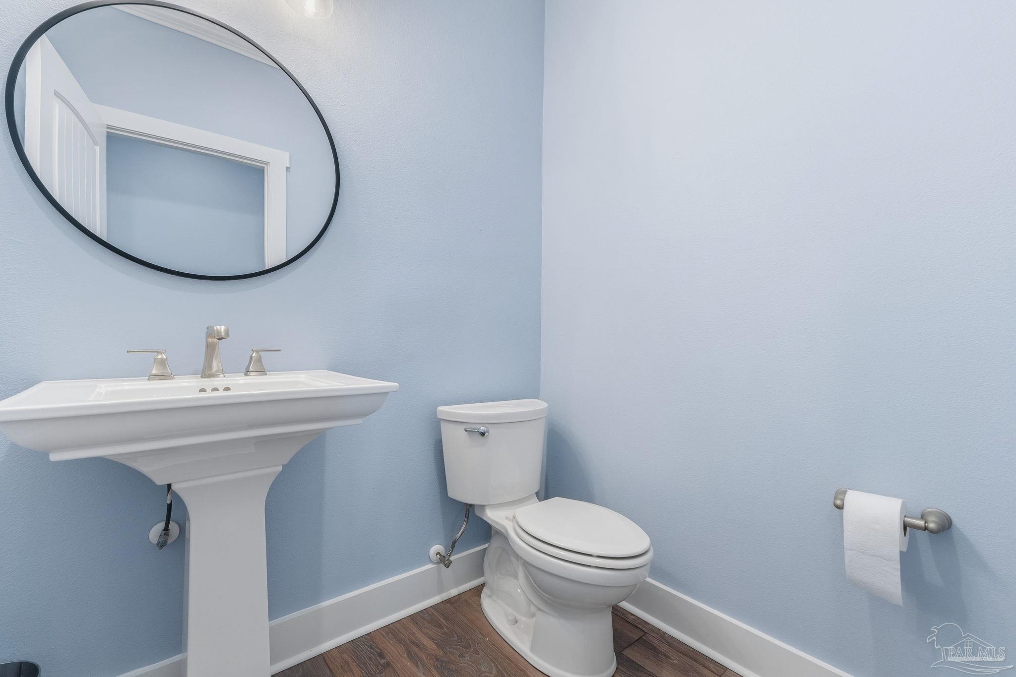 2018 Rambling Oaks Drive Cantonment, FL 32533 - Photo 29 of 64 a bathroom with a sink a mirror and toilet