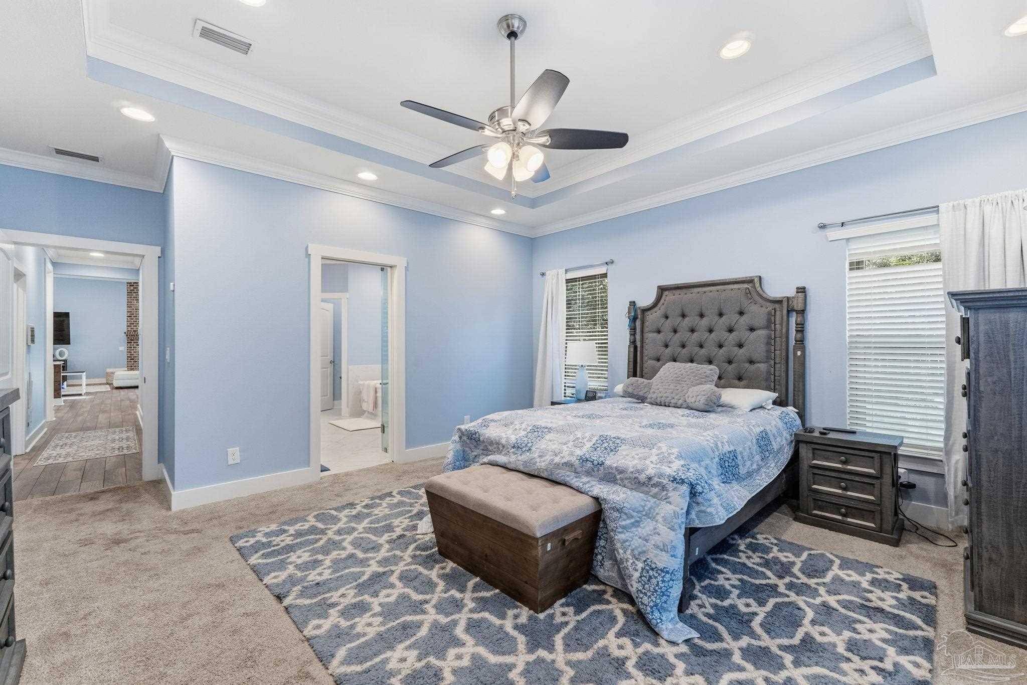 2018 Rambling Oaks Drive Cantonment, FL 32533 - Photo 31 of 64 a bedroom with a bed and a chandelier
