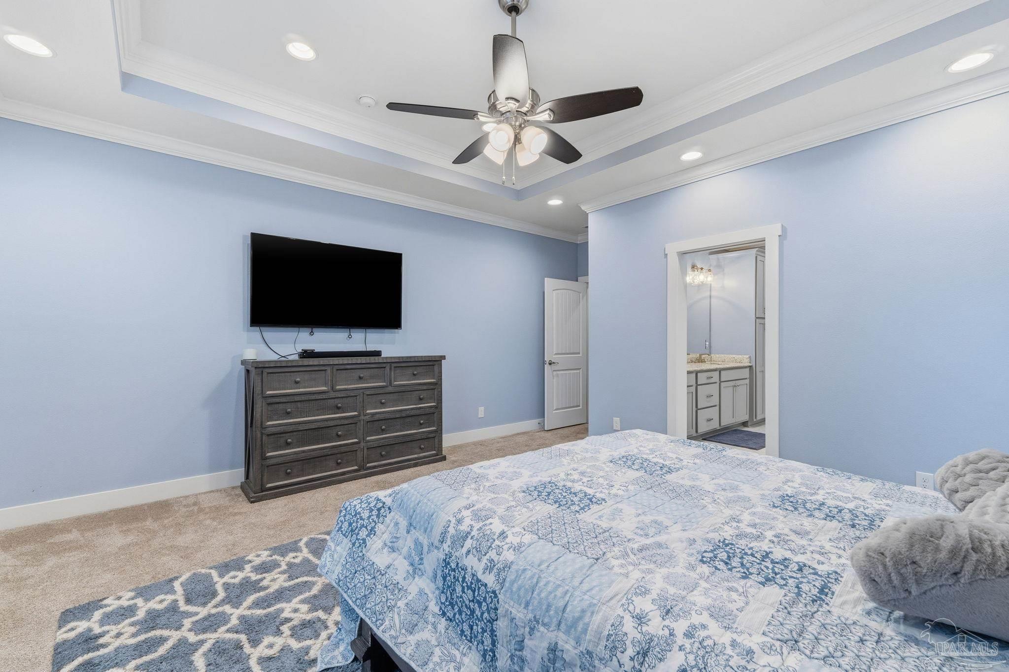 2018 Rambling Oaks Drive Cantonment, FL 32533 - Photo 32 of 64 a bedroom with a bed and a flat screen tv