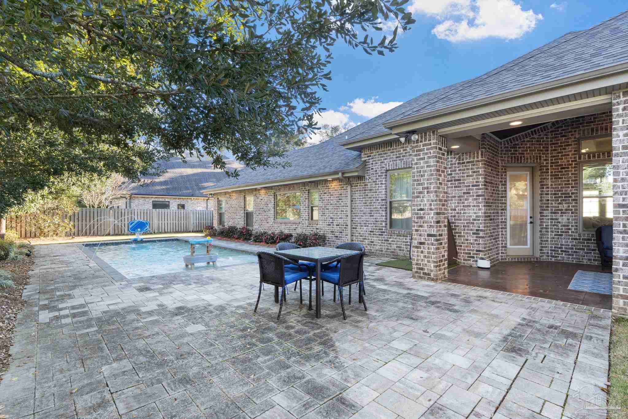 2018 Rambling Oaks Drive Cantonment, FL 32533 - Photo 45 of 64 a view of a house with backyard and sitting area
