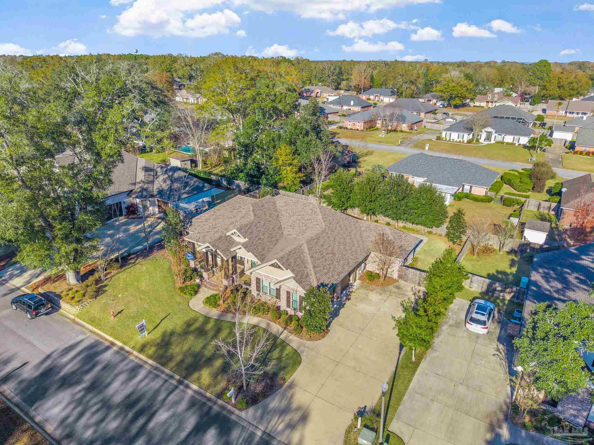 2018 Rambling Oaks Drive Cantonment, FL 32533 - Photo 52 of 64 an aerial view of residential house with outdoor space and swimming pool