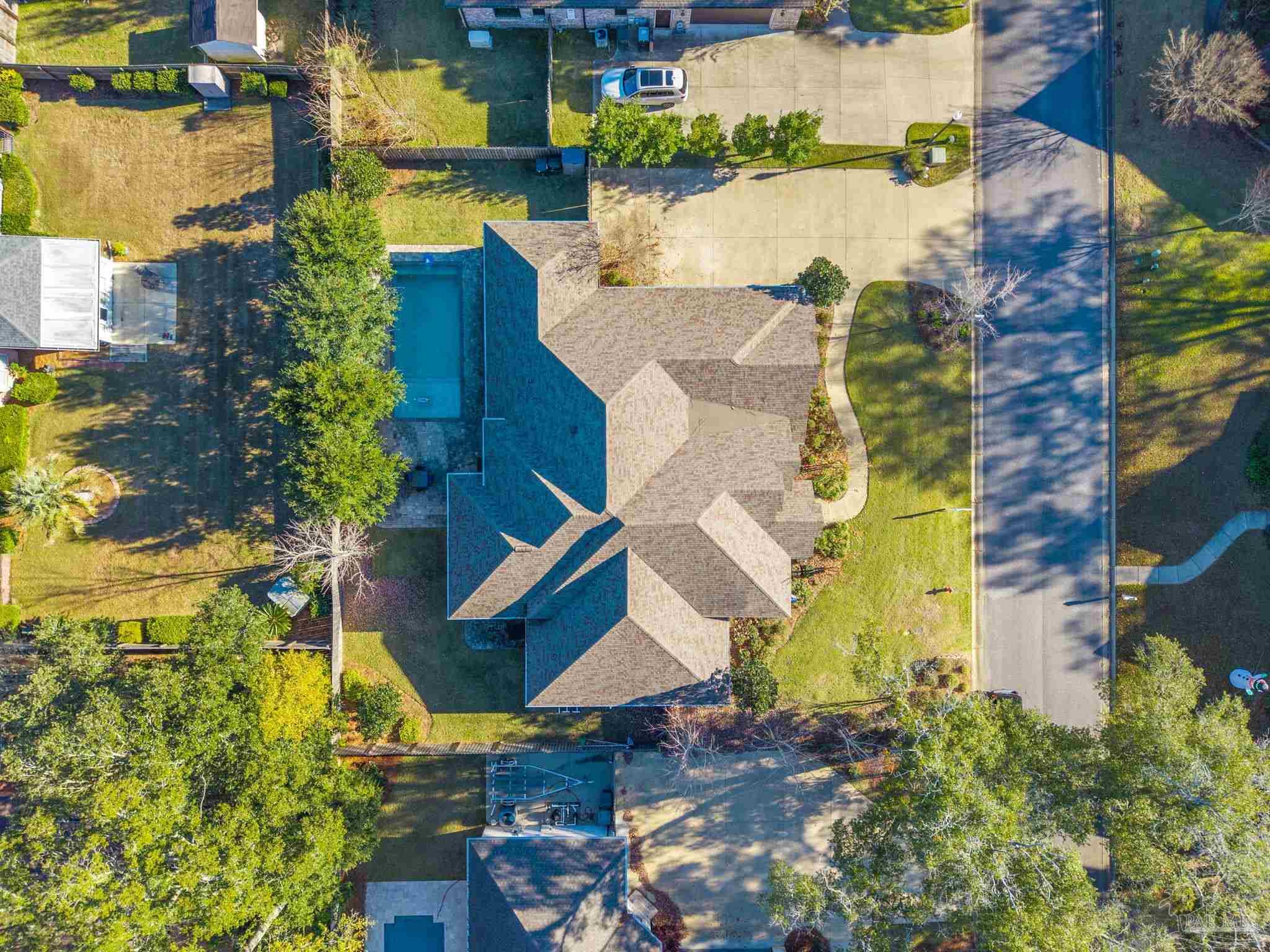 2018 Rambling Oaks Drive Cantonment, FL 32533 - Photo 57 of 64 an aerial view of residential house with outdoor space and swimming pool