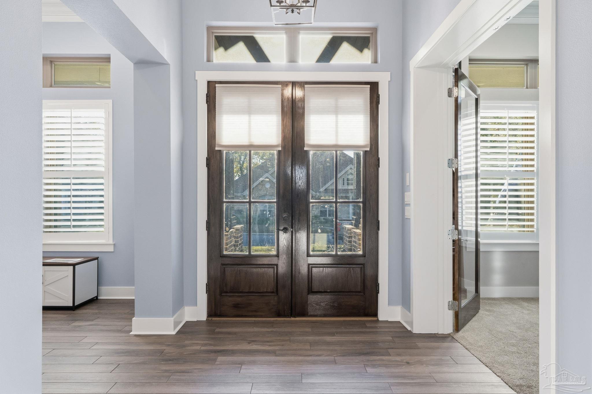 2018 Rambling Oaks Drive Cantonment, FL 32533 - Photo 6 of 64 a view of entryway and hall with wooden floor