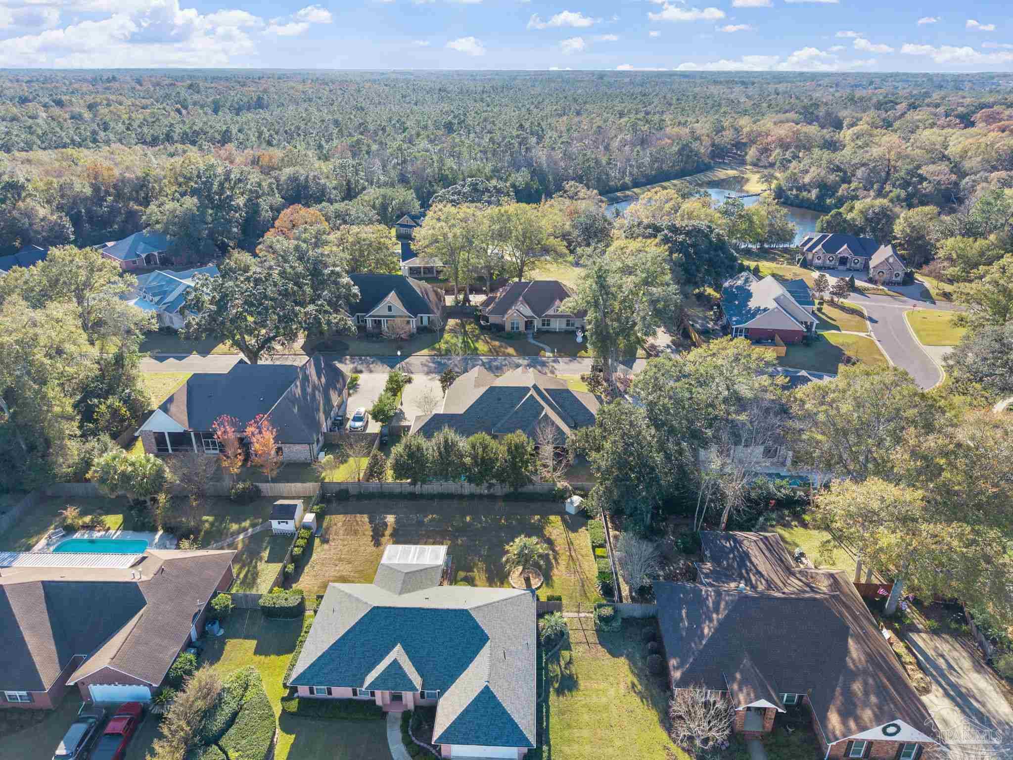 2018 Rambling Oaks Drive Cantonment, FL 32533 - Photo 63 of 64 an aerial view of houses with yard